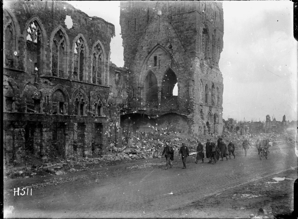 New Zealand soldiers passing the remains of the Cloth Hall, Ypres, Belgium.